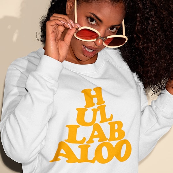 Model wearing the Hullabaloo sweatshirt, a tribute to Tarantino's Once Upon a Time in Hollywood - stylish movie fan clothing